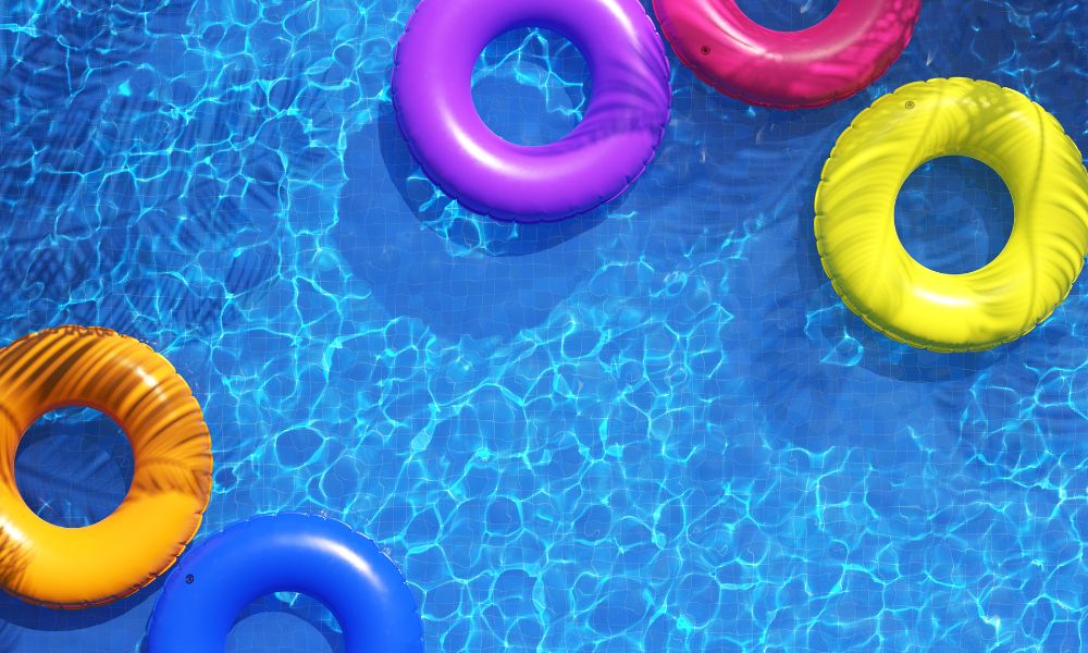 colorful round floats in a swimming pool; inspire your writing with these colors of summer